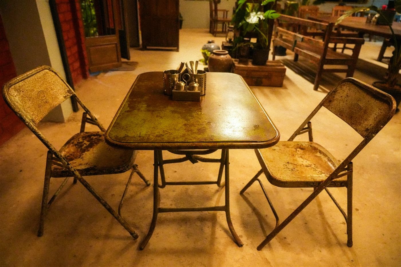 Egg Cartel interior — vintage folding table set for two
